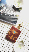 Load and play video in Gallery viewer, LoZ | Sheikah Sketchbook | Acrylic Book Charm
