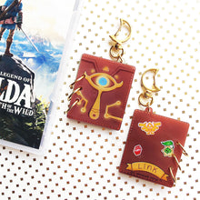 Load image into Gallery viewer, LoZ | Sheikah Sketchbook | Acrylic Book Charm
