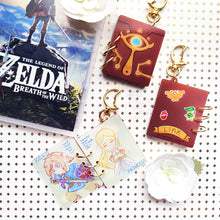 Load image into Gallery viewer, LoZ | Sheikah Sketchbook | Acrylic Book Charm
